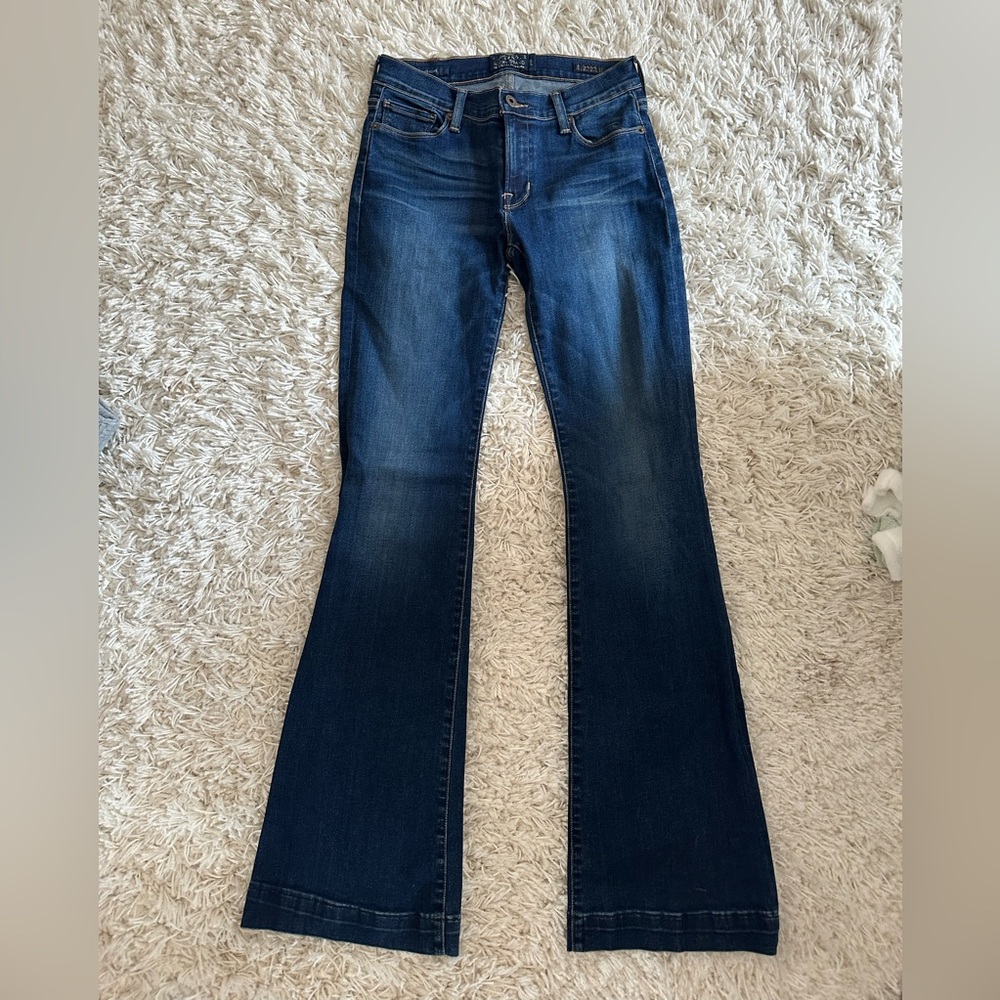 Lucky Brand dark wash flare jeans.